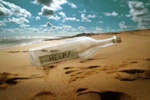 Help message in a bottle on beach